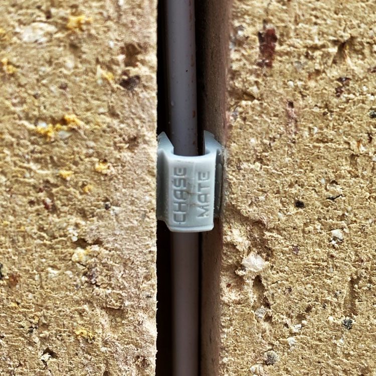 Cables retained in a chased channel